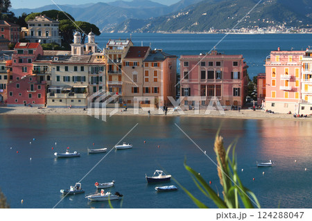 View from rock on sea, Bay of Silence, fishing cove, Italy. Tourism and recreation. Ecologically clean nature. Traditional old buildings. Historical center. 124288047