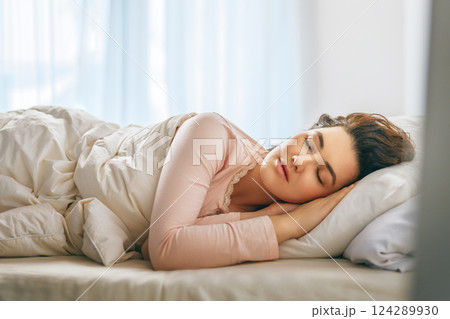 Woman is sleeping in her bedroom 124289930