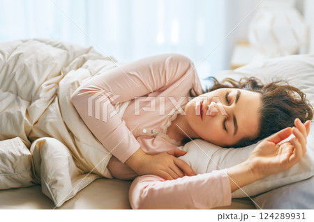 Woman is sleeping in her bedroom 124289931