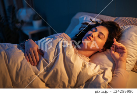 Woman is sleeping in her bedroom 124289980
