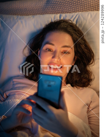 Woman is sleeping in her bedroom 124289996