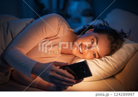 Woman is sleeping in her bedroom 124289997