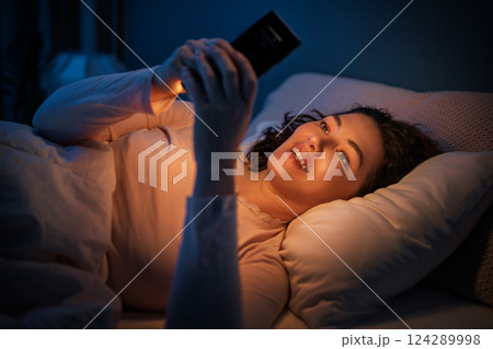 Woman is sleeping in her bedroom 124289998