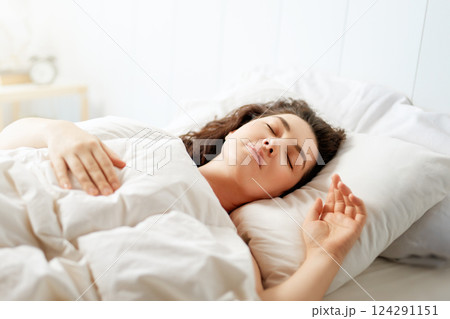 woman is sleeping in the bedroom woman is sleeping in the bedroom 124291151