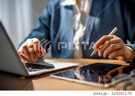 Woman is working in the office Woman is working in the office 124291170