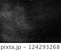 particles of charcoal on black background,abstract powder splatted background 124293268