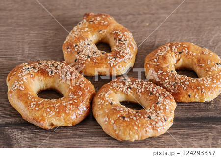 Quick Bagels on Wooden background, Jewish sweet bread Quick Bagels on Wooden background, Jewish sweet bread 124293357