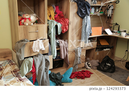 Scattered Things in Wardrobe, Disorder in Clothes. Childrens room Organizing Cleanliness Scattered Things in Wardrobe, Disorder in Clothes. Childrens room Organizing Cleanliness 124293373