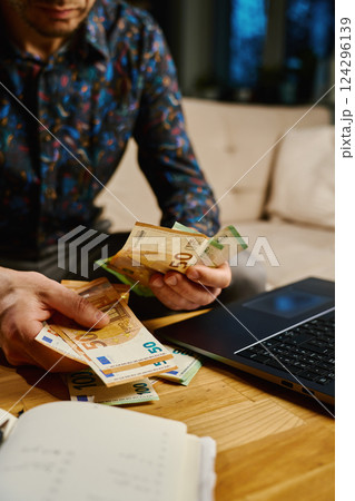 Man Counting Euro Banknotes, Financial Planning with Cash Money Man Counting Euro Banknotes, Financial Planning with Cash Money 124296139