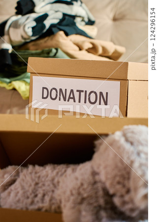 Clothes prepared for donation in cardboard box Clothes prepared for donation in cardboard box 124296154