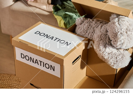 Clothes prepared for donation in cardboard box 124296155