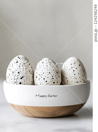 Happy Easter minimalist speckled eggs in ceramic bowl with elegant typography, Happy Easter concept 124298249