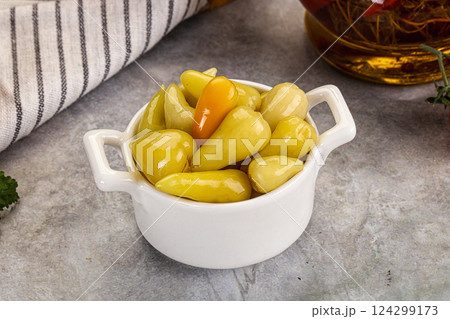 Turkish traditional marinated mini chili peppers 124299173