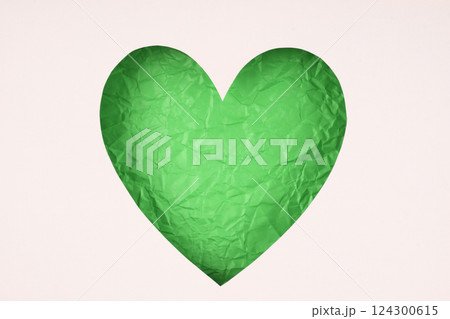 Green paper cut heart shape for decoration background. Green paper cut heart shape for decoration background. 124300615