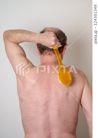 Portrait of man in the bath against white background Portrait of man in the bath against white background 124301349