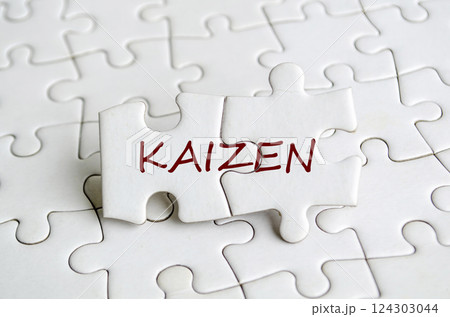 Kaizen text on jigsaw puzzle that represent change for the better by small, steady, cumulative gains. Continuous improvement concept. Kaizen text on jigsaw puzzle that represent change for the better by small, steady, cumulative gains. Continuous improvement concept. 124303044