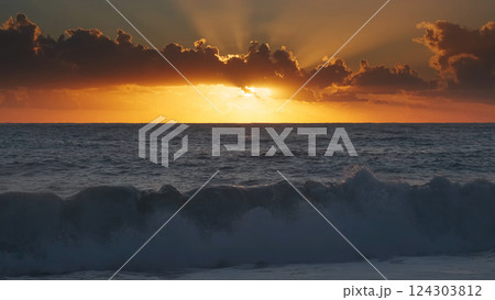 Sunset over sea waves with vibrant colors Sunset over sea waves with vibrant colors 124303812