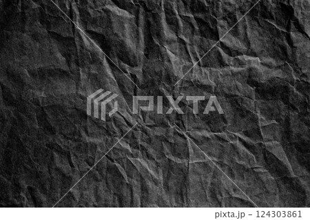 Black crumpled paper material texture 124303861