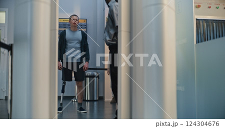 Man with Prosthetic Leg and Adult Woman Walking Through X-ray Metal Detector Scanner Man with Prosthetic Leg and Adult Woman Walking Through X-ray Metal Detector Scanner 124304676