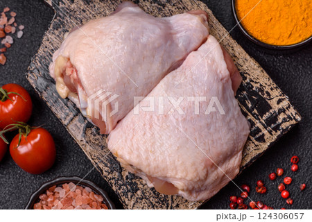 Fresh raw chicken thighs with salt and spices Fresh raw chicken thighs with salt and spices 124306057