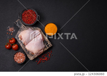Fresh raw chicken thighs with salt and spices 124306060