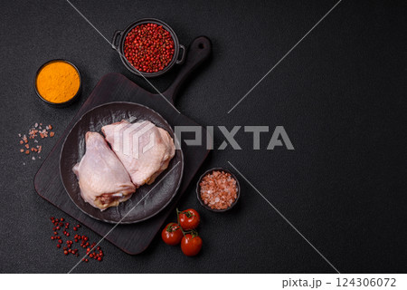 Fresh raw chicken thighs with salt and spices Fresh raw chicken thighs with salt and spices 124306072