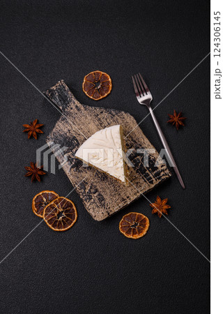Piece of cheesecake with nuts and berries with winter pattern Piece of cheesecake with nuts and berries with winter pattern 124306145