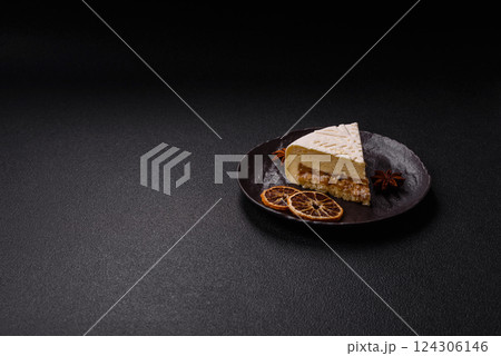 Piece of cheesecake with nuts and berries with winter pattern Piece of cheesecake with nuts and berries with winter pattern 124306146