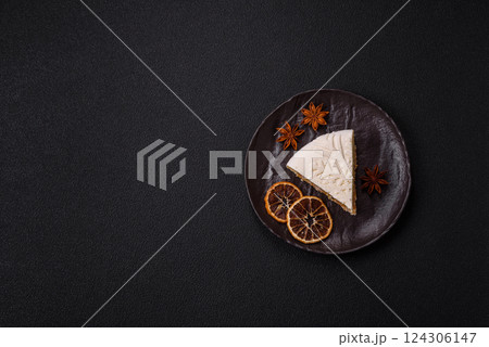 Piece of cheesecake with nuts and berries with winter pattern Piece of cheesecake with nuts and berries with winter pattern 124306147