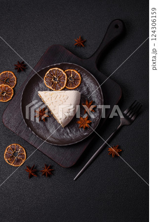 Piece of cheesecake with nuts and berries with winter pattern 124306159