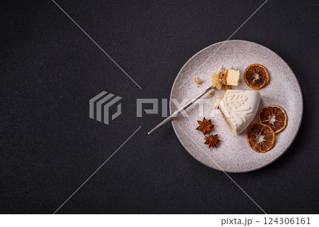Piece of cheesecake with nuts and berries with winter pattern 124306161
