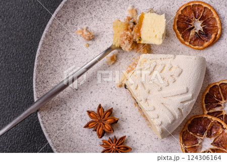 Piece of cheesecake with nuts and berries with winter pattern Piece of cheesecake with nuts and berries with winter pattern 124306164