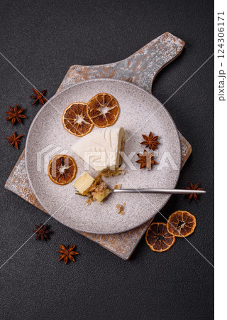 Piece of cheesecake with nuts and berries with winter pattern Piece of cheesecake with nuts and berries with winter pattern 124306171