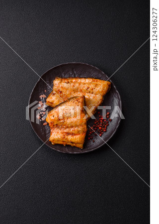 Grilled fish fillet with salt, spices and herbs 124306277