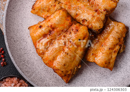 Grilled fish fillet with salt, spices and herbs Grilled fish fillet with salt, spices and herbs 124306303
