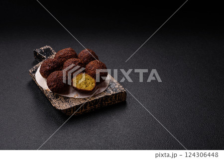 Fried chickpea falafel balls with salt, spices and herbs Fried chickpea falafel balls with salt, spices and herbs 124306448