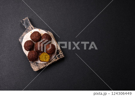 Fried chickpea falafel balls with salt, spices and herbs 124306449
