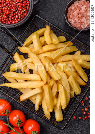 Delicious crispy French fries with salt and spices Delicious crispy French fries with salt and spices 124306607