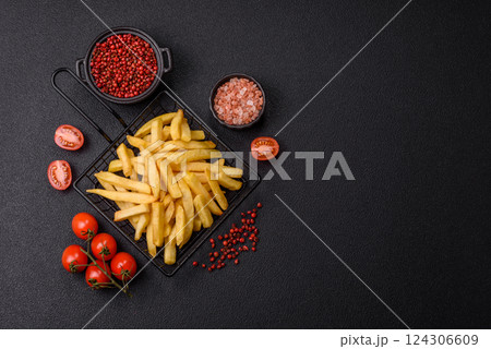 Delicious crispy French fries with salt and spices Delicious crispy French fries with salt and spices 124306609