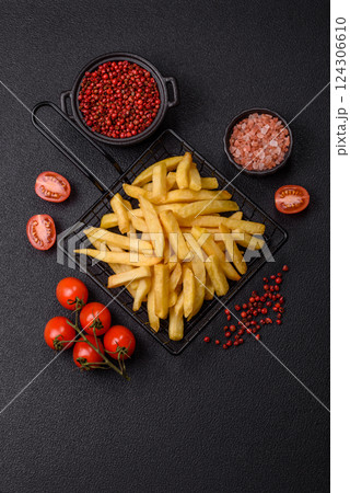 Delicious crispy French fries with salt and spices Delicious crispy French fries with salt and spices 124306610