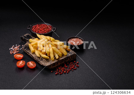 Delicious crispy French fries with salt and spices Delicious crispy French fries with salt and spices 124306634