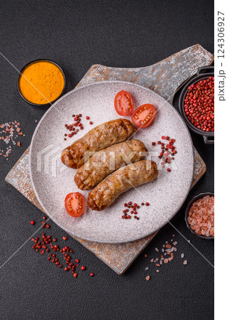 Juicy chicken or pork sausages with salt and spices Juicy chicken or pork sausages with salt and spices 124306927
