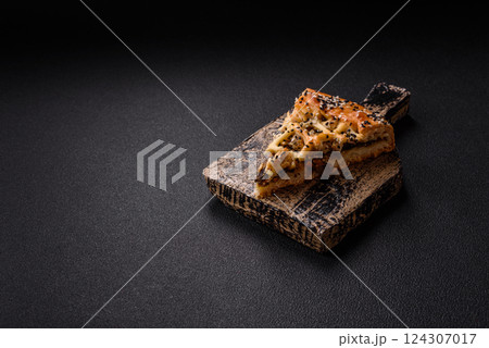 French quiche with chicken or salmon, cheese, salt, spices and herbs 124307017