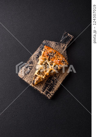 French quiche with chicken or salmon, cheese, salt, spices and herbs 124307019