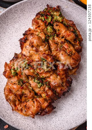 Grilled chicken fillet with garlic sauce, hot pepper Grilled chicken fillet with garlic sauce, hot pepper 124307138