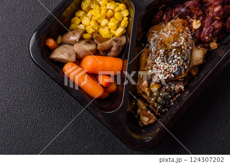 Grilled mackerel fillet pieces with vegetables, salt and spices Grilled mackerel fillet pieces with vegetables, salt and spices 124307202