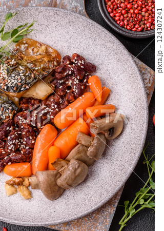 Grilled mackerel fillet pieces with vegetables, salt and spices Grilled mackerel fillet pieces with vegetables, salt and spices 124307241