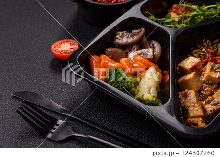 Quinoa bowl with tofu, steamed vegetables, grains, seeds and spices Quinoa bowl with tofu, steamed vegetables, grains, seeds and spices 124307260