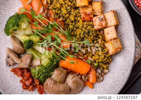 Quinoa bowl with tofu, steamed vegetables, grains, seeds and spices Quinoa bowl with tofu, steamed vegetables, grains, seeds and spices 124307287