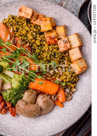 Quinoa bowl with tofu, steamed vegetables, grains, seeds and spices Quinoa bowl with tofu, steamed vegetables, grains, seeds and spices 124307288